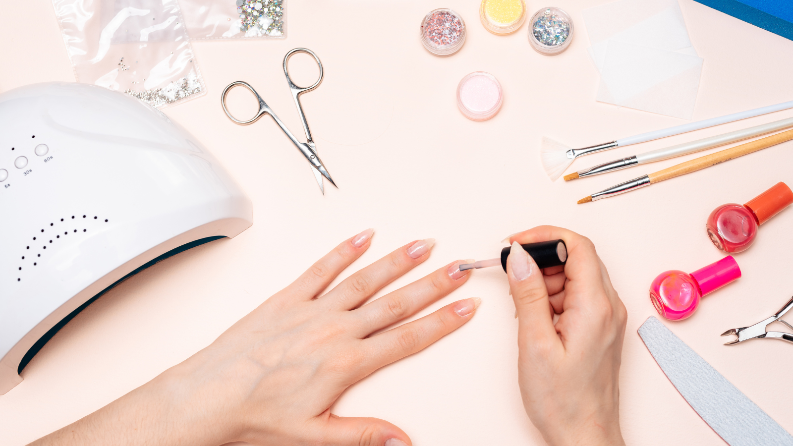 person getting manicure using acrylates, common allergen in glues & adhesives